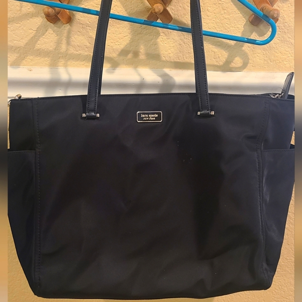 Kate spade diaper bag, black, used. W changing pad and lots of pockets.